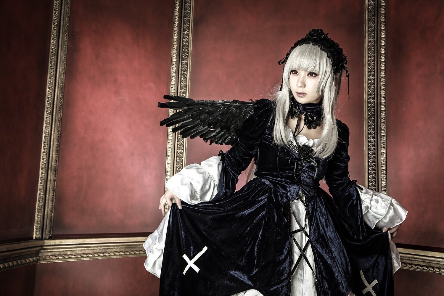 1girl black_dress black_wings cross dress flower frills gothic_lolita hairband lolita_fashion long_hair long_sleeves looking_at_viewer puffy_sleeves rose silver_hair solo standing suigintou wings