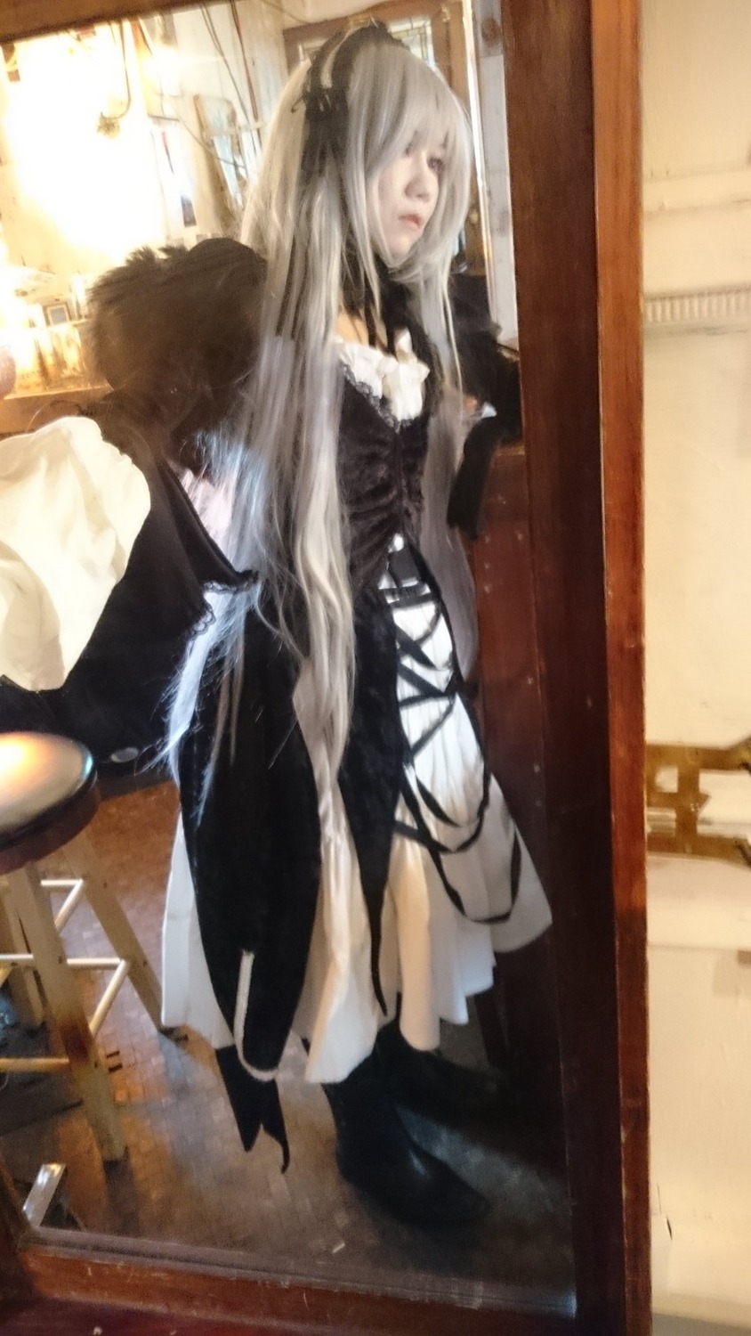 1girl dress frills gothic_lolita indoors long_hair long_sleeves silver_hair solo standing suigintou very_long_hair window