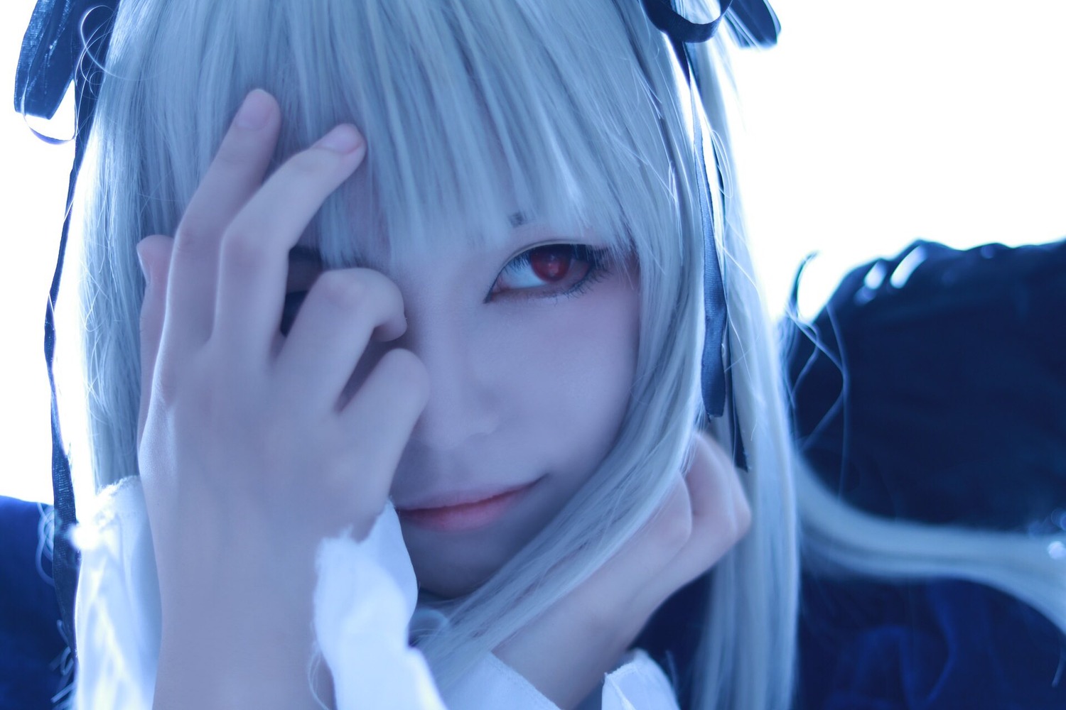 1girl bangs blurry close-up closed_mouth depth_of_field face hair_over_one_eye lips long_hair looking_at_viewer portrait red_eyes solo suigintou