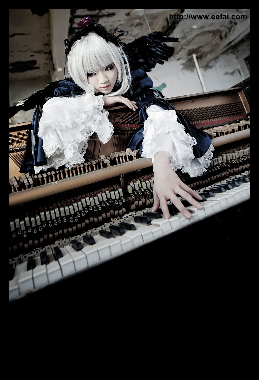 1girl black_border dress frills letterboxed lips long_sleeves looking_at_viewer nail_polish silver_hair solo suigintou white_hair wings