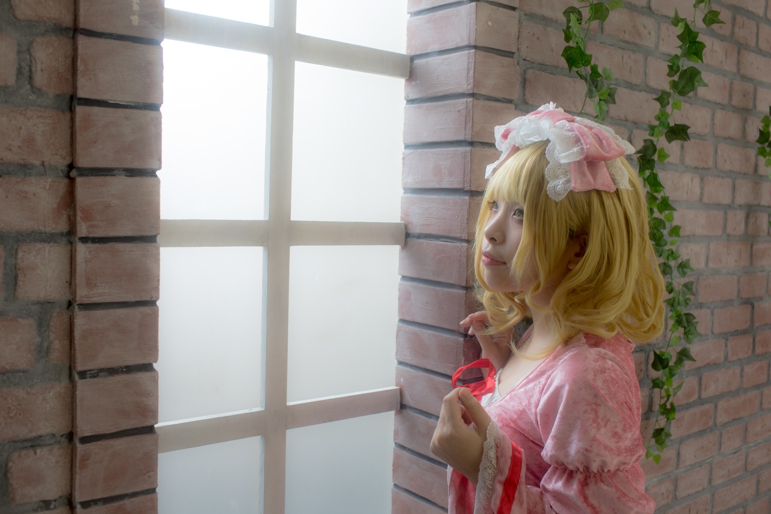 1girl blonde_hair brick_wall dress hat hinaichigo indoors jewelry lips pink_dress profile puffy_short_sleeves puffy_sleeves short_sleeves solo upper_body wall window