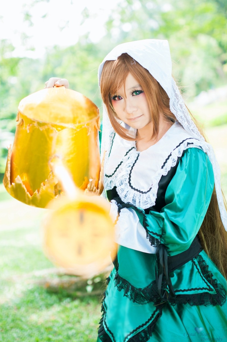 1boy alcohol apron auto_tagged beer beer_mug blurry blurry_background brown_hair cup depth_of_field frills green_eyes heterochromia holding hood long_hair mug smile solo suiseiseki