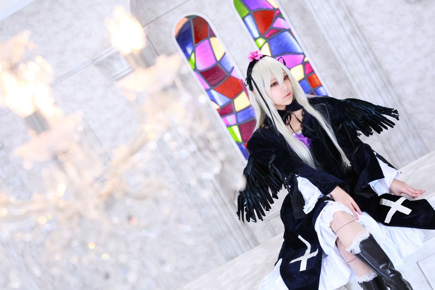 1girl black_wings blurry boots butterfly_wings dress feathered_wings feathers long_hair long_sleeves silver_hair sitting solo stained_glass suigintou umbrella wings