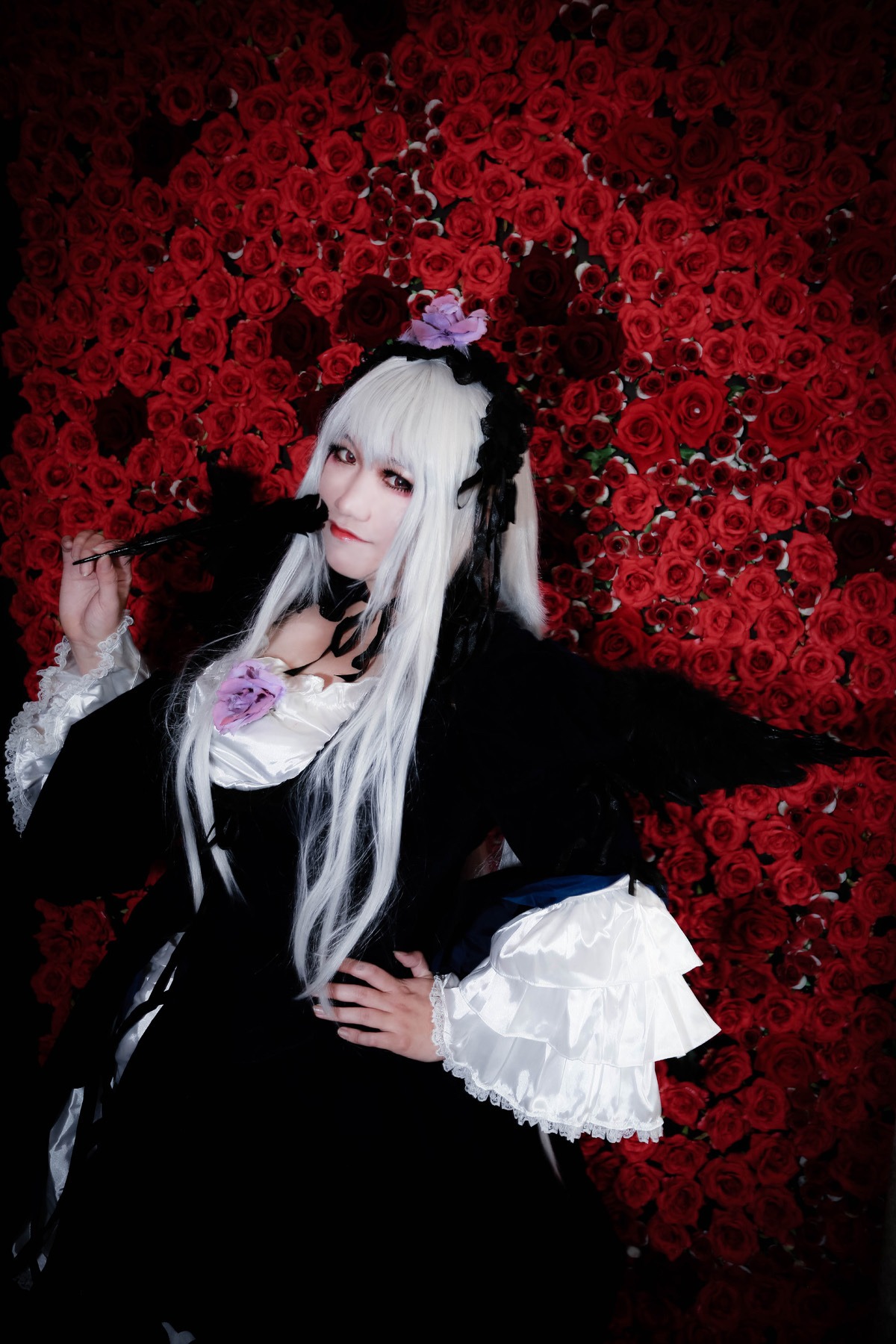 1girl black_dress dress flower gothic_lolita hairband lolita_fashion long_hair red_eyes red_flower red_rose rose solo suigintou thorns white_hair wings