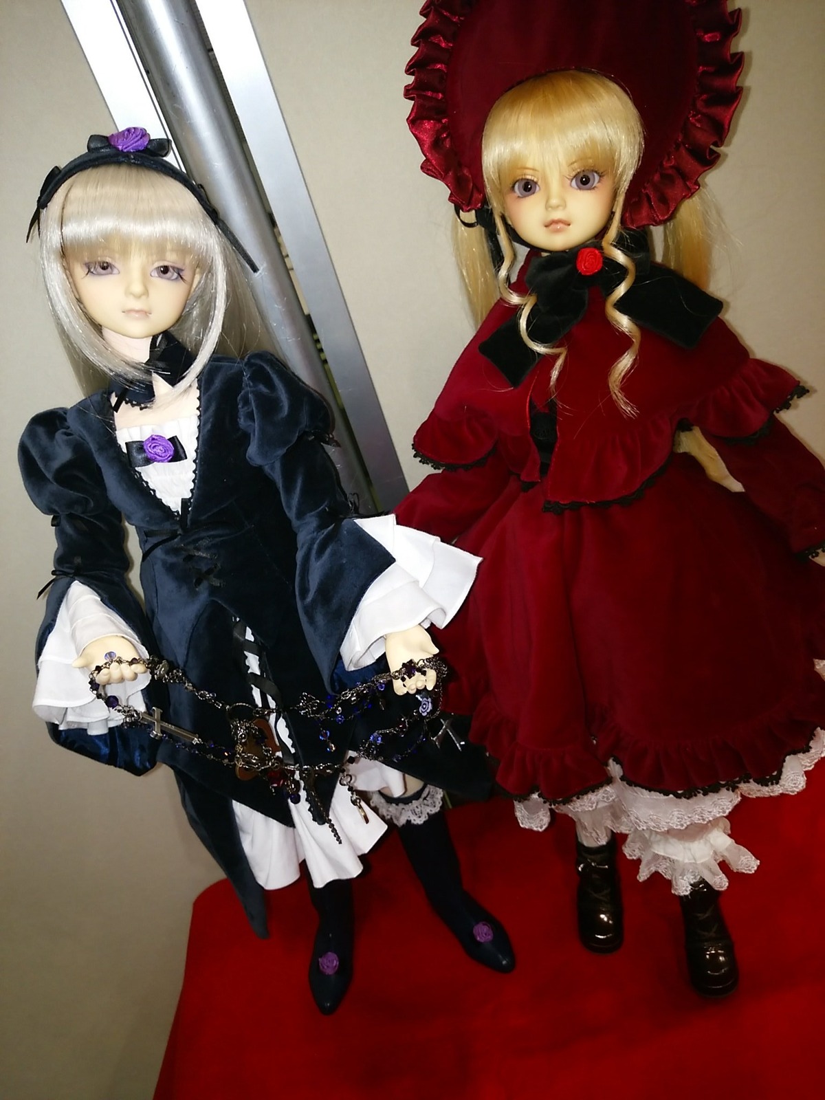 1girl black_footwear blonde_hair bonnet boots doll dress frills hat long_sleeves looking_at_viewer multiple_dolls standing tagme twins umbrella