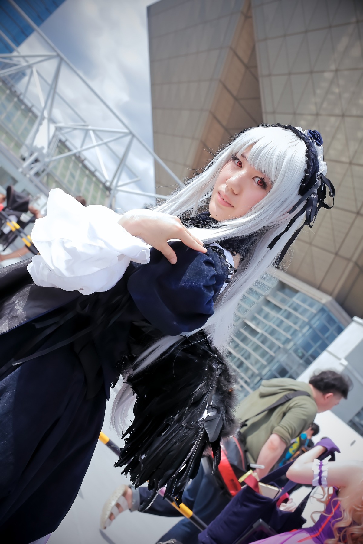 blurry depth_of_field dress frills gothic_lolita hairband lolita_fashion lolita_hairband long_sleeves multiple_boys red_eyes solo suigintou wings