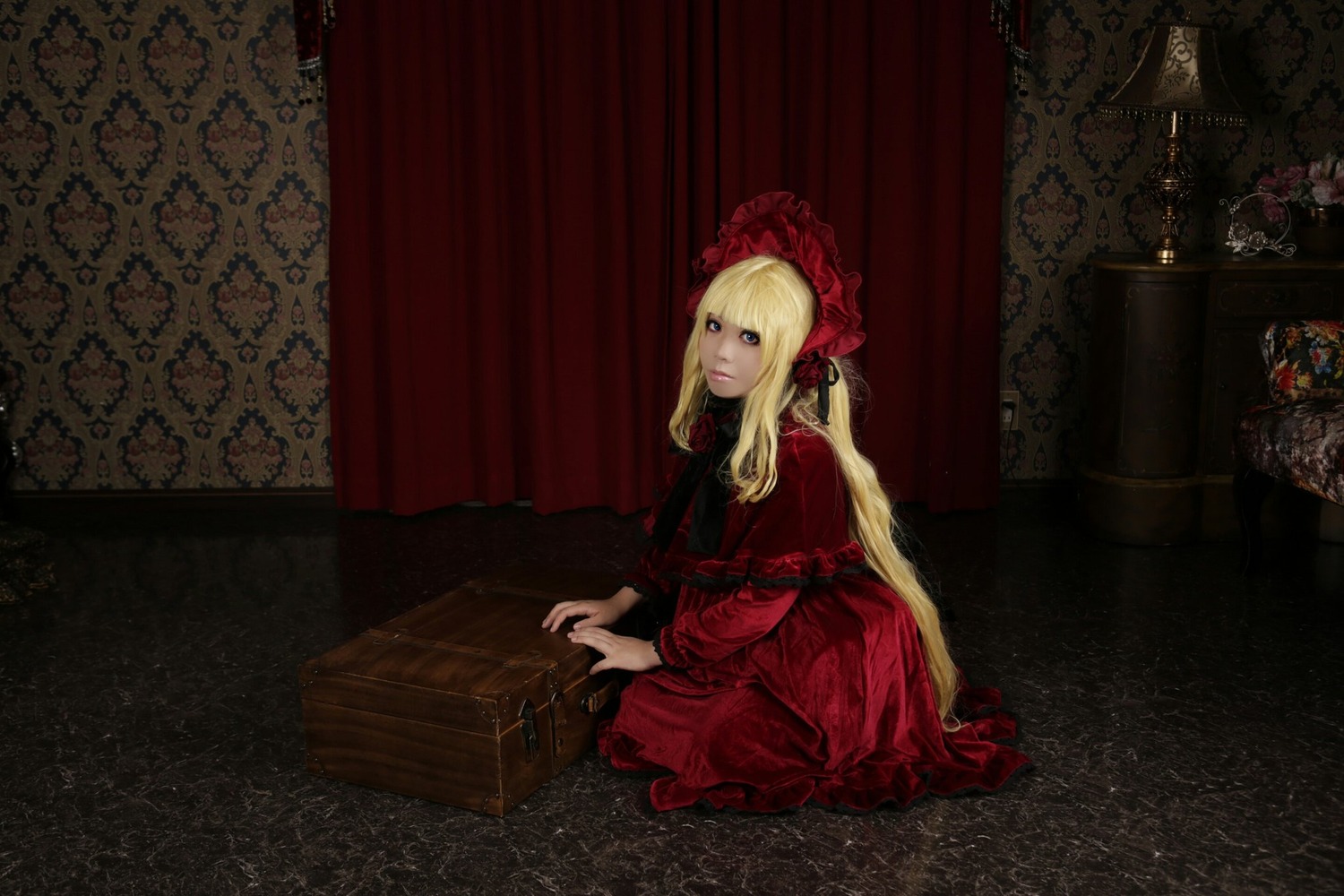 1girl bangs blonde_hair blue_eyes bonnet curtains dress flower indoors lolita_fashion long_hair long_sleeves looking_at_viewer red_dress rose shinku sitting solo