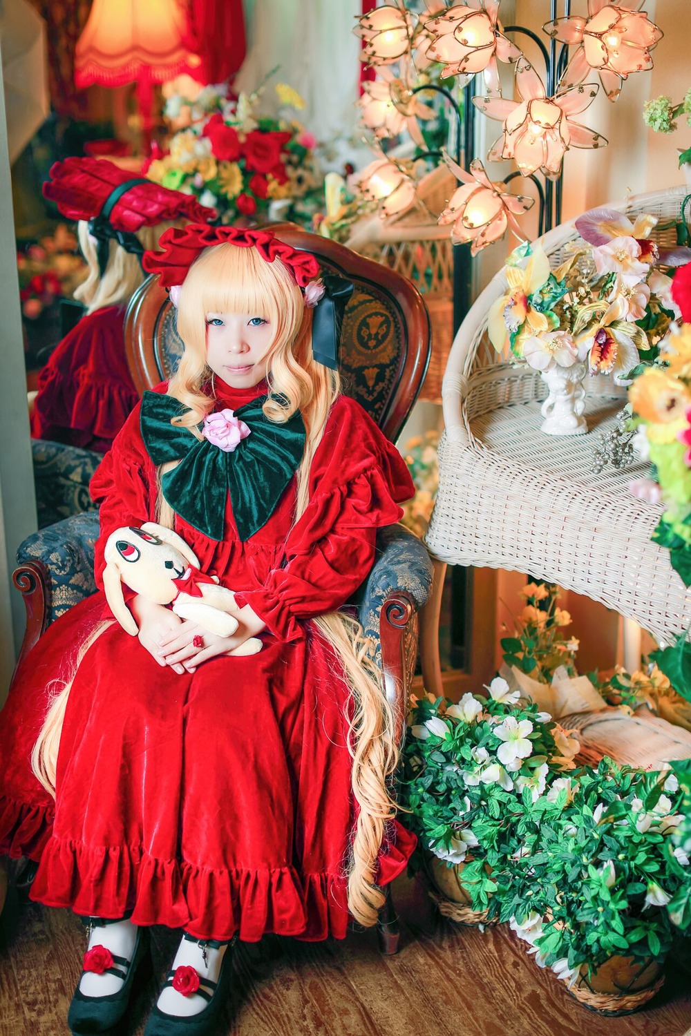 1girl blonde_hair blue_eyes dress flower long_hair mary_janes red_dress rose shoes sitting solo stuffed_animal