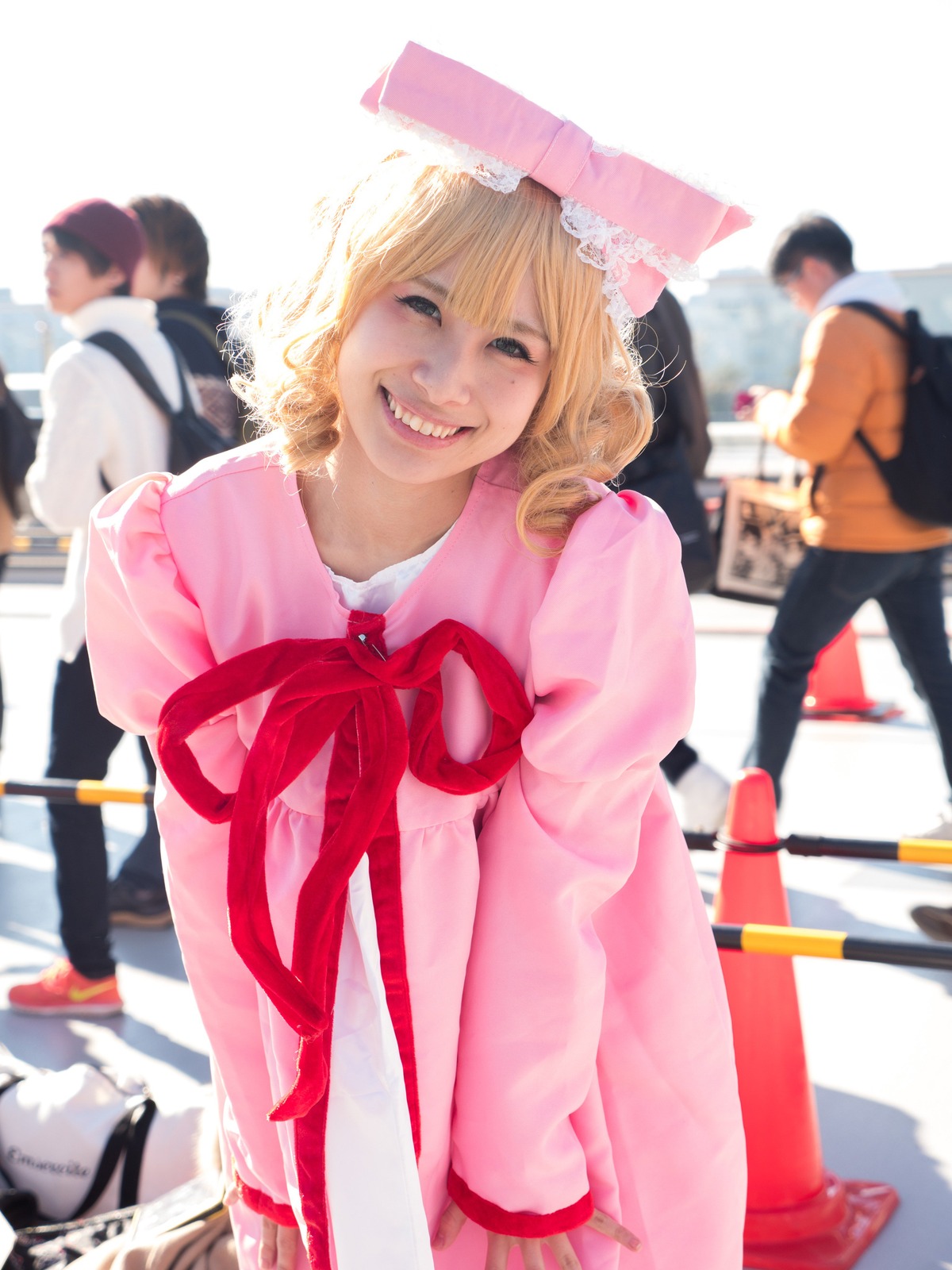 blonde_hair blurry blurry_background blurry_foreground depth_of_field dress hat hinaichigo multiple_boys open_mouth pink_dress ribbon smile solo teeth umbrella