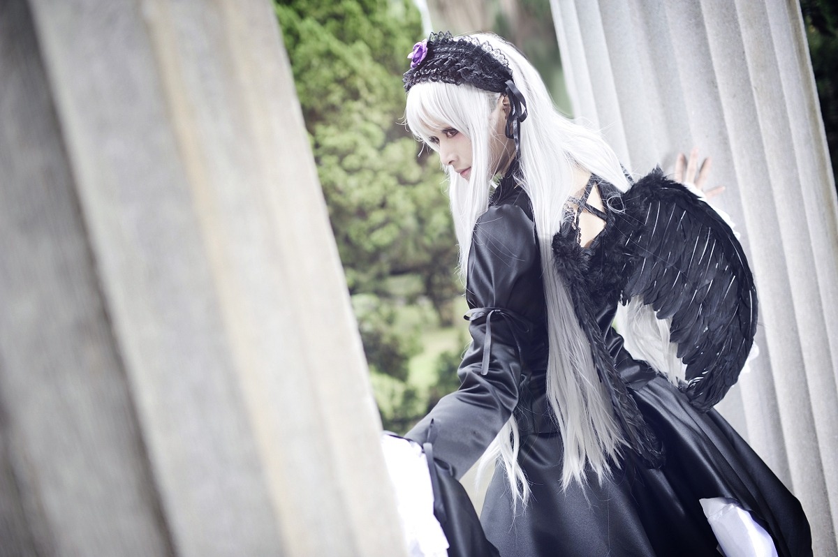 1girl black_dress black_wings blurry blurry_background curtains dress feathered_wings frills hairband juliet_sleeves long_hair long_sleeves profile silver_hair sitting solo suigintou wings