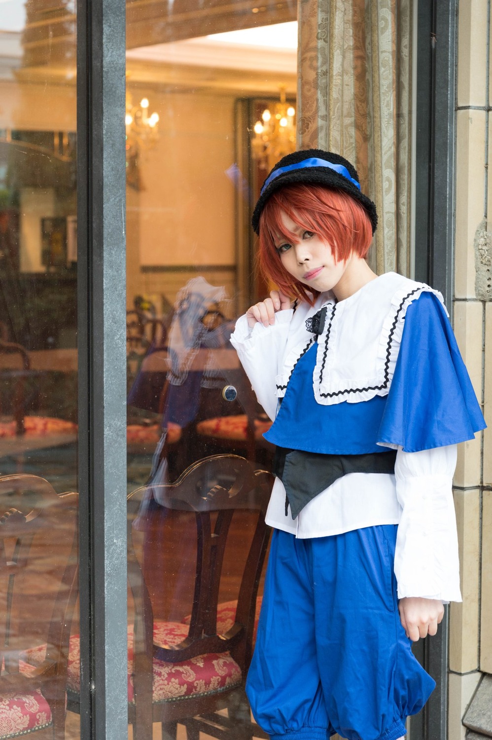 1girl blue_headwear blurry capelet depth_of_field hat lips long_sleeves looking_at_viewer photo short_hair solo souseiseki standing