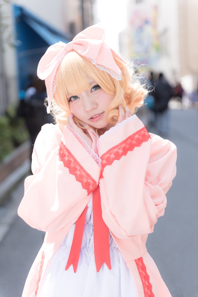 1girl blonde_hair blurry blurry_background blurry_foreground bow depth_of_field dress hinaichigo lips looking_at_viewer parted_lips photo see-through solo solo_focus striped upper_body veil