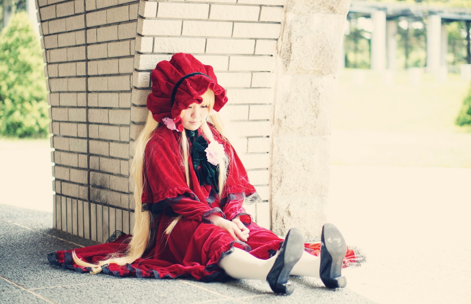 1girl bonnet closed_eyes cup doll_joints dress frills long_hair red_dress shinku sitting solo very_long_hair