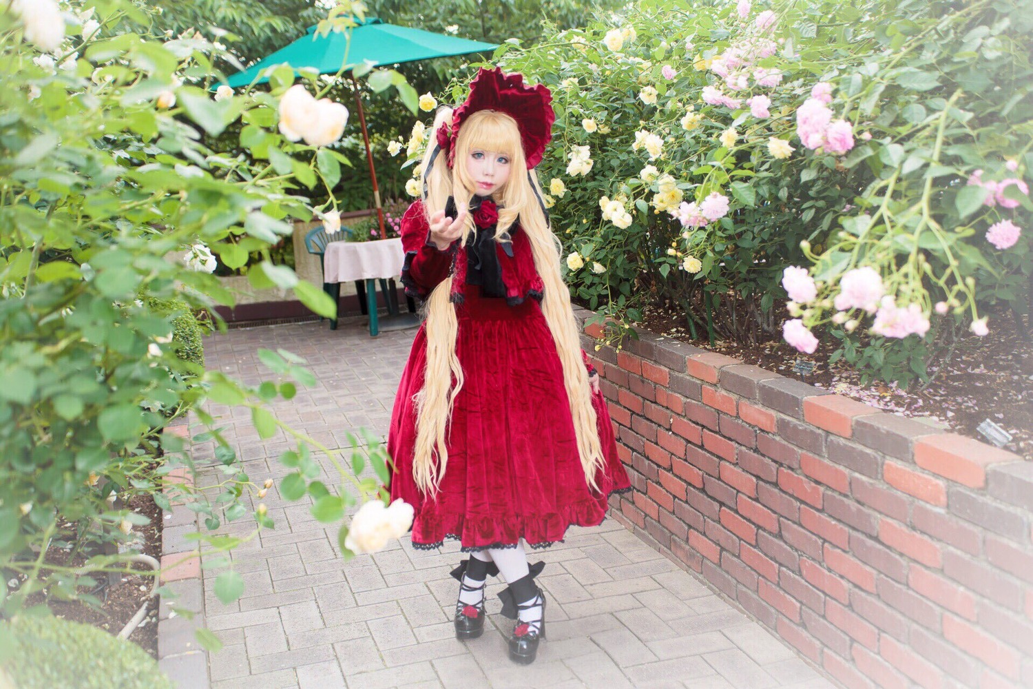 1girl blonde_hair blue_eyes bow dress flower long_hair looking_at_viewer outdoors red_dress shinku shoes solo standing