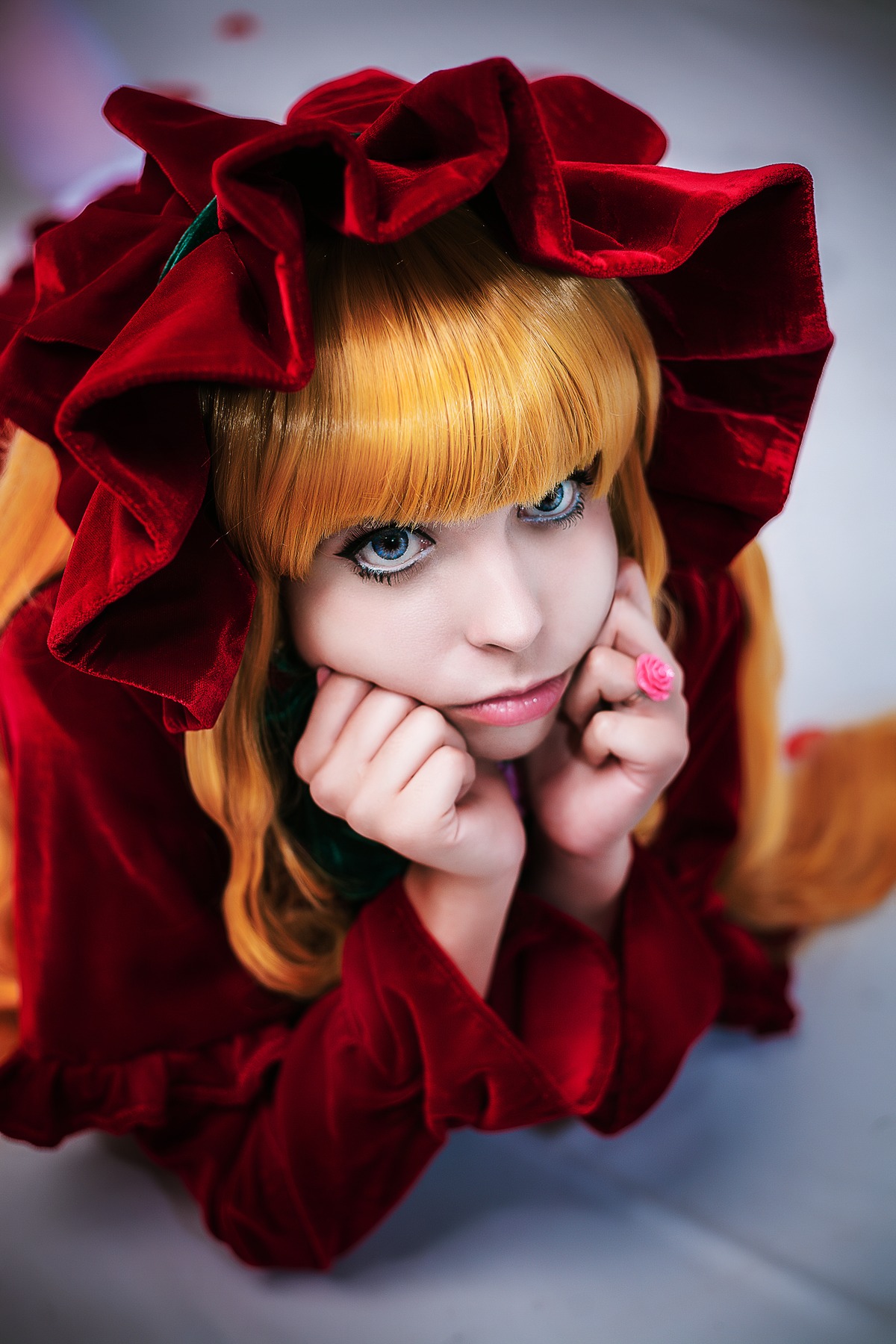 1girl bangs blonde_hair blue_eyes blurry blurry_background bow depth_of_field dress lips long_hair looking_at_viewer ribbon shinku solo