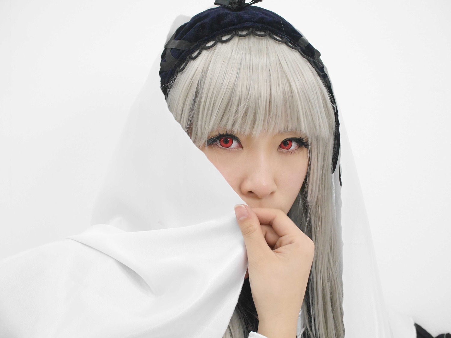 1girl bangs blunt_bangs closed_mouth face fingernails hairband lips long_hair looking_at_viewer nail_polish red_eyes simple_background solo suigintou white_hair