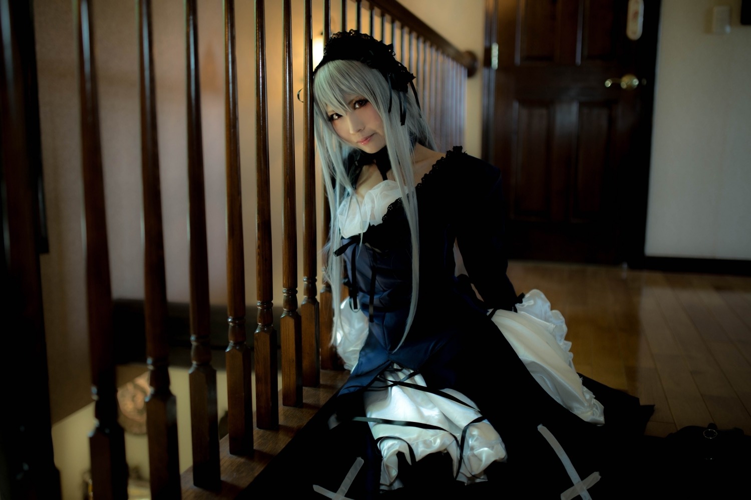 1girl dress frills hairband long_hair long_sleeves looking_at_viewer silver_hair sitting solo standing suigintou