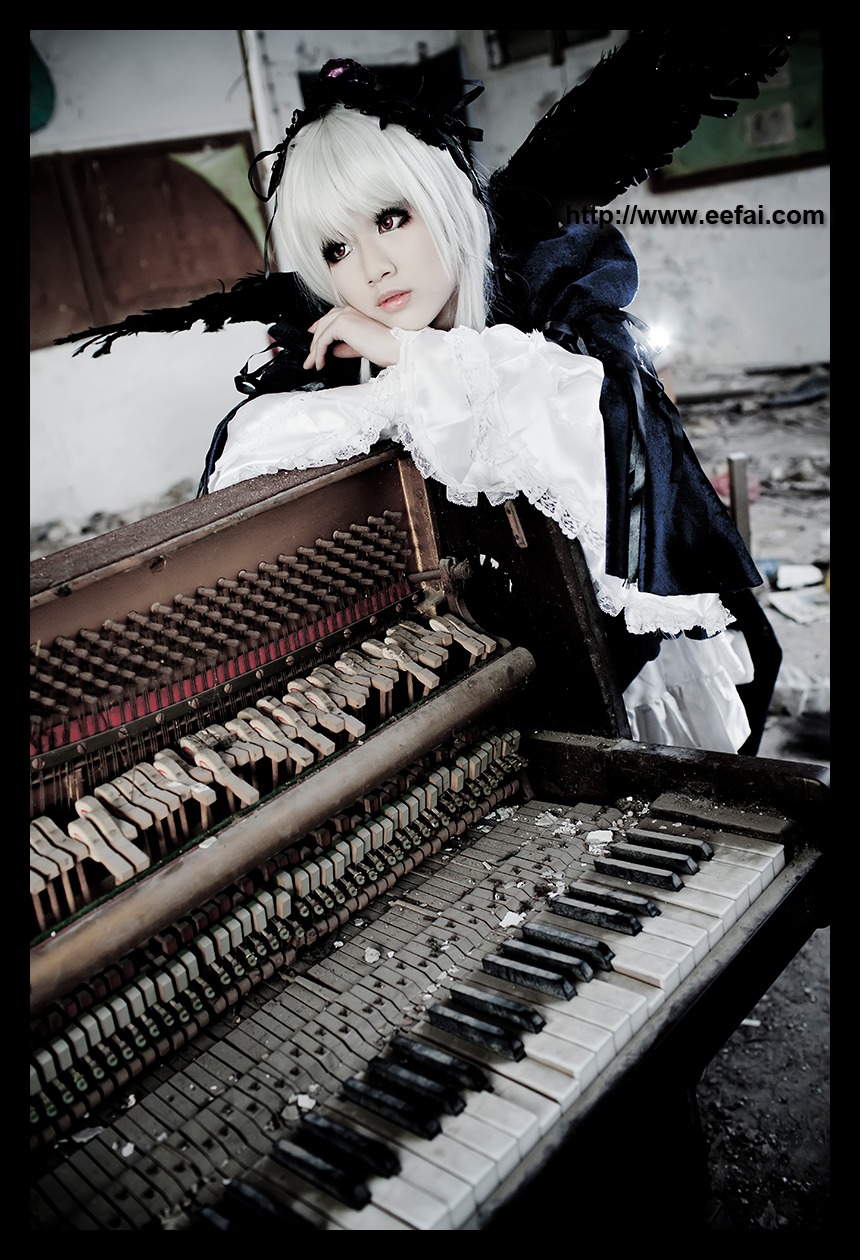 1girl black_border black_dress dress frills gothic gothic_lolita hairband instrument letterboxed lips lolita_fashion lolita_hairband long_sleeves solo suigintou wings