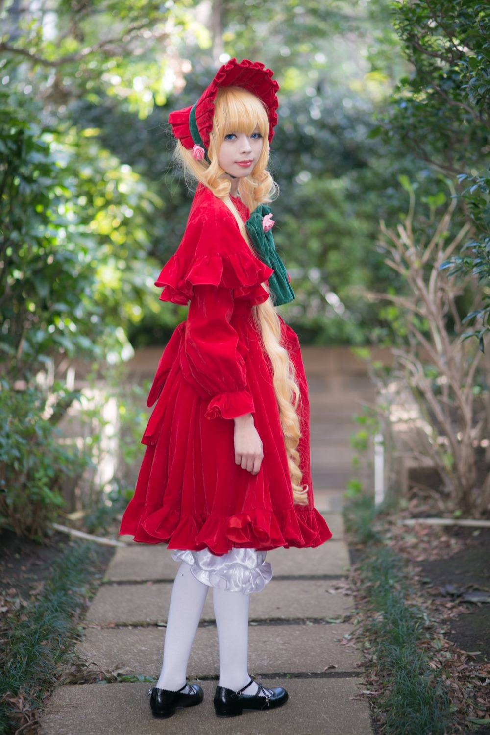 1girl black_footwear blonde_hair bloomers blue_eyes blurry bonnet depth_of_field doll_joints dress flower grass mary_janes outdoors red_dress shinku shoes solo standing underwear white_legwear