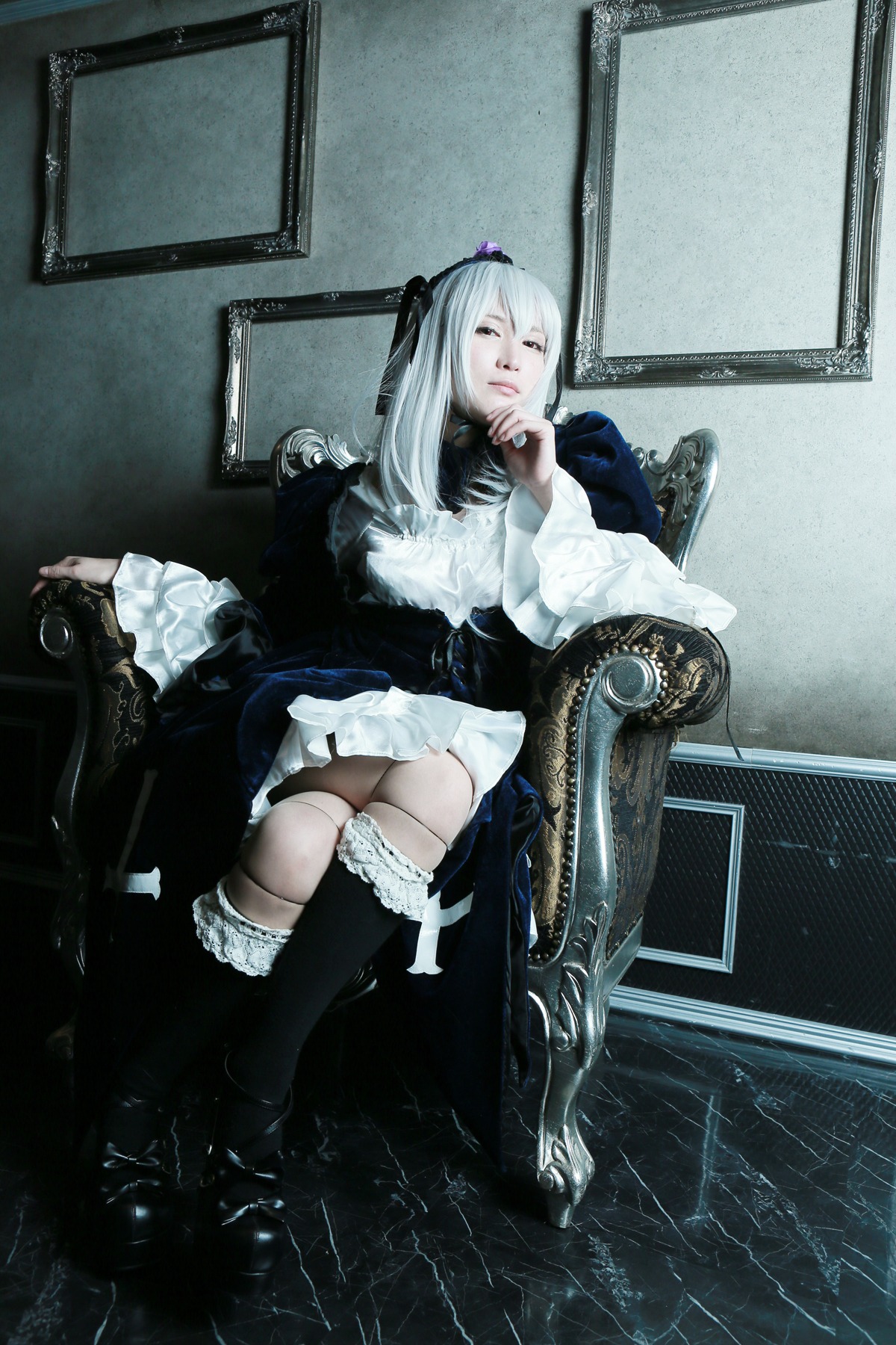 1girl boots crossed_legs dress frills gothic_lolita hairband long_hair long_sleeves nail_polish sitting solo suigintou white_hair