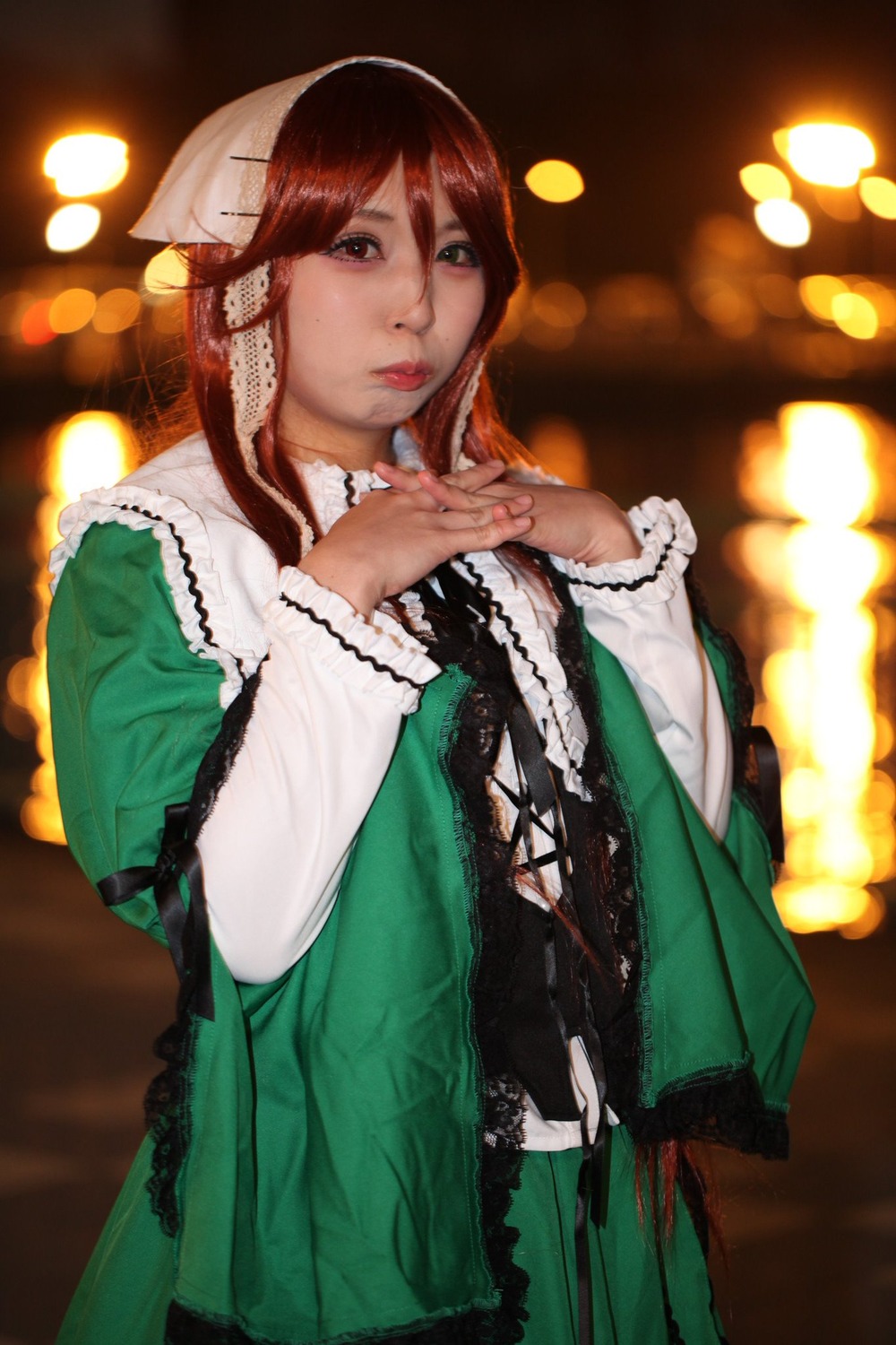 1girl bokeh brown_hair frills green_dress hands_clasped hands_together interlocked_fingers lips long_hair long_sleeves looking_at_viewer own_hands_together solo suiseiseki wide_sleeves