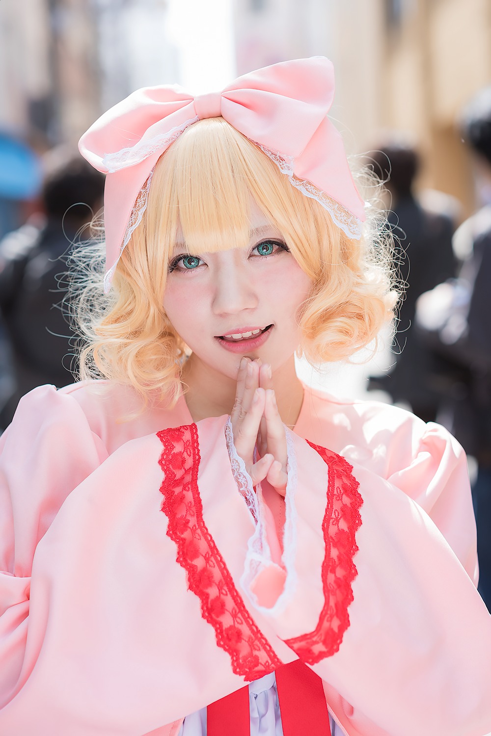 1girl bangs blonde_hair blue_eyes blurry blurry_background blurry_foreground bow depth_of_field dress frills hair_bow hinaichigo lips looking_at_viewer photo short_hair smile solo striped teeth upper_body