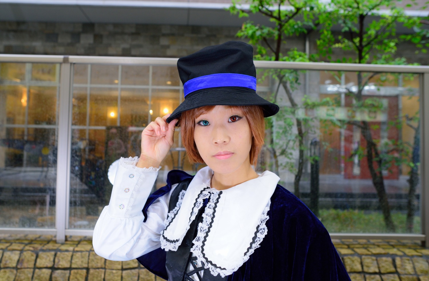 1girl blurry brick_wall brown_hair dress hat lips long_sleeves looking_at_viewer outdoors short_hair smile solo souseiseki top_hat upper_body