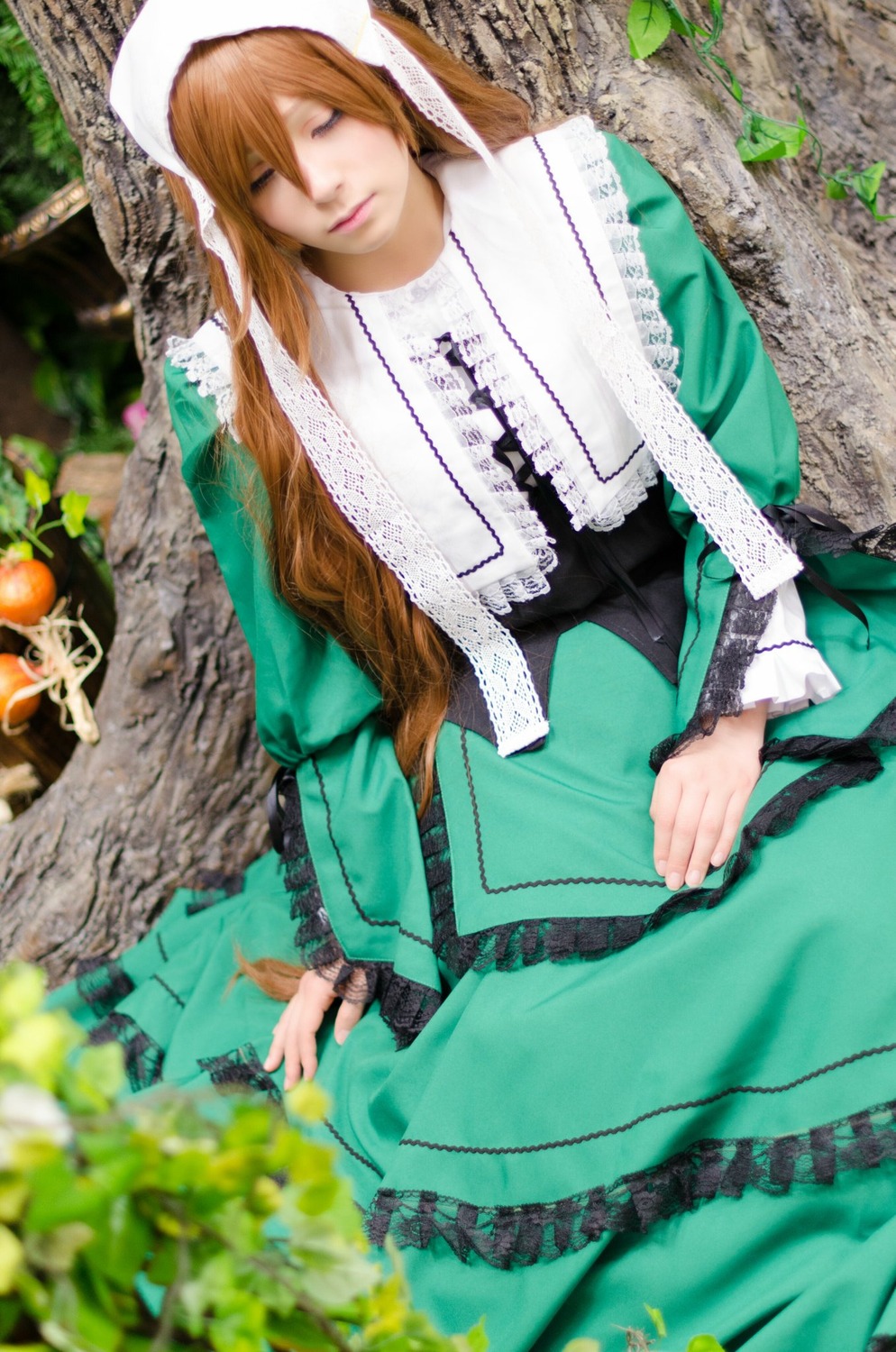 1girl blonde_hair blurry brown_hair closed_eyes depth_of_field dress green_dress lips long_hair long_sleeves nun sitting solo suiseiseki