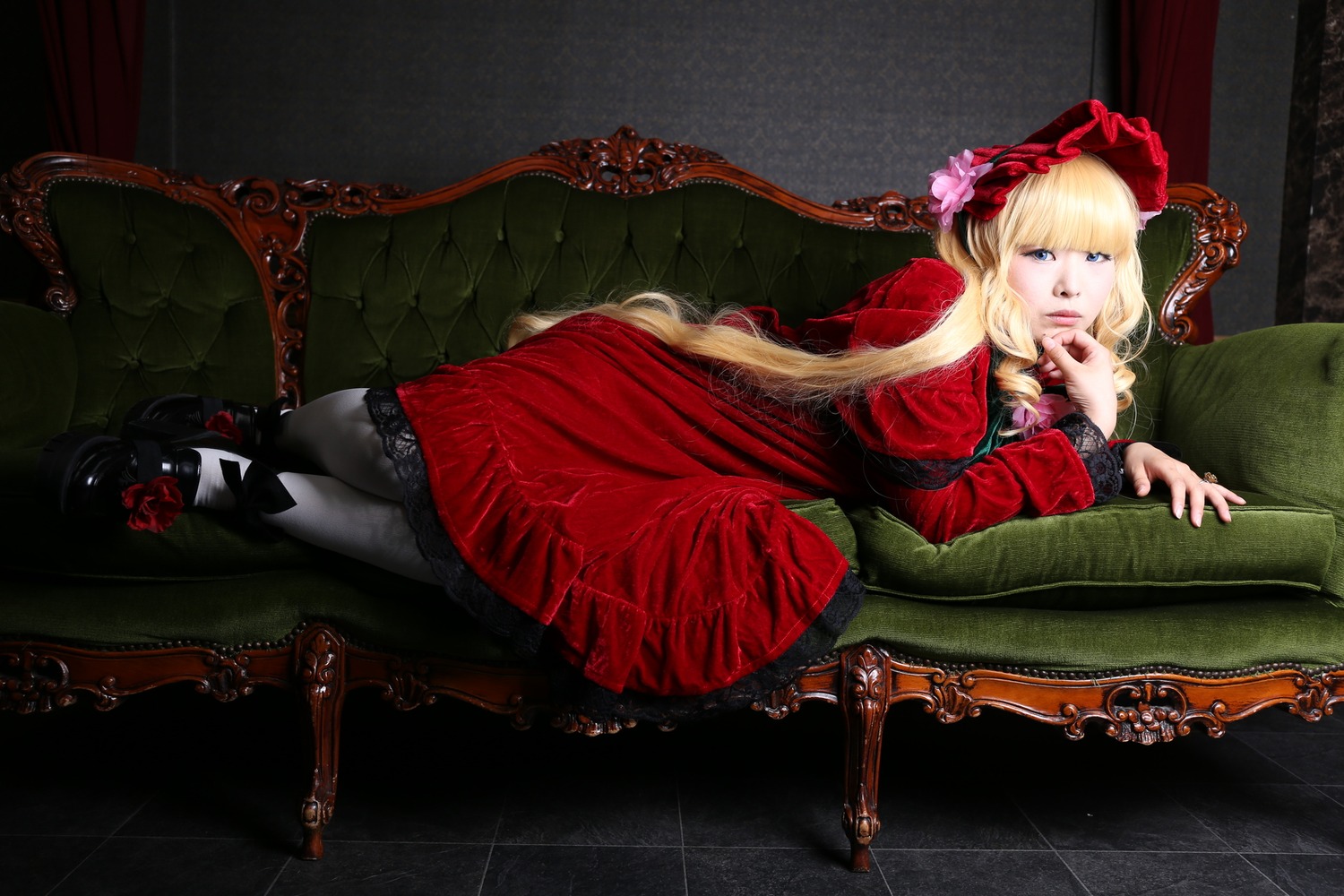 1girl blonde_hair blue_eyes chair couch dress flower long_hair lying on_side red_dress red_flower red_rose rose shinku solo