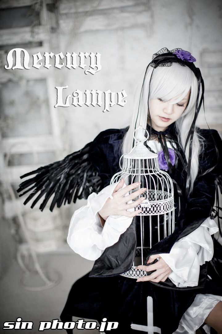 1girl black_dress blurry blurry_background character_name closed_eyes closed_mouth depth_of_field dress feathers frills gothic_lolita hairband instrument lolita_fashion long_hair long_sleeves music playing_instrument silver_hair solo suigintou very_long_hair wings