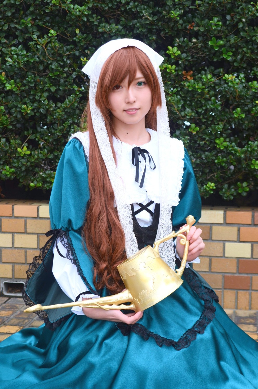 1girl blue_dress brown_hair dress green_eyes head_scarf heterochromia holding long_hair outdoors solo suiseiseki