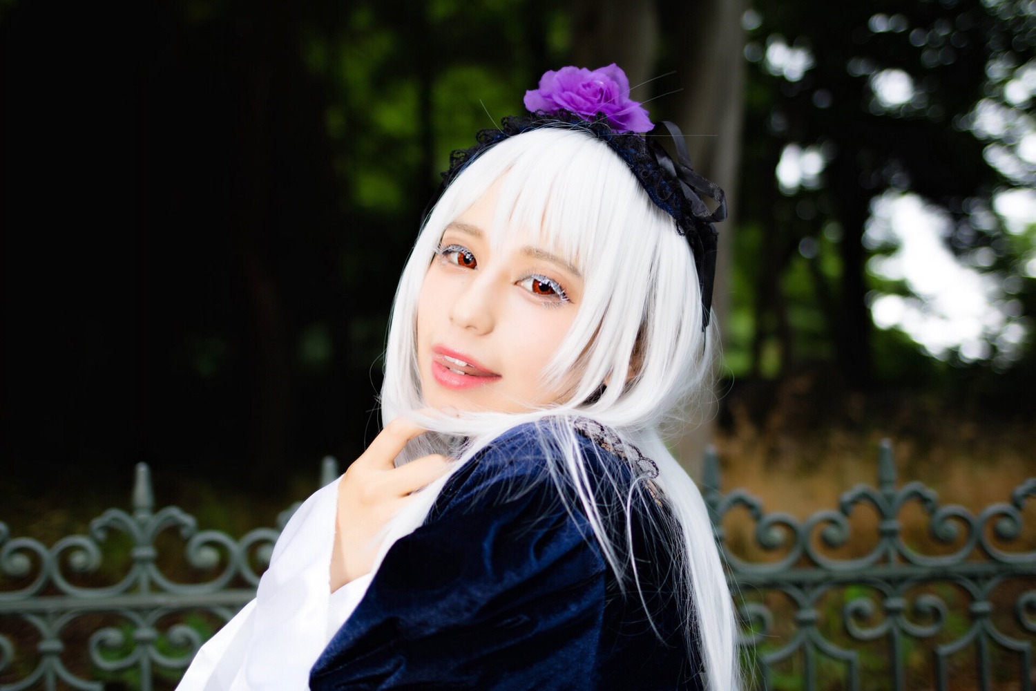 1girl bangs blurry blurry_background depth_of_field flower hairband lips looking_at_viewer red_eyes solo suigintou upper_body