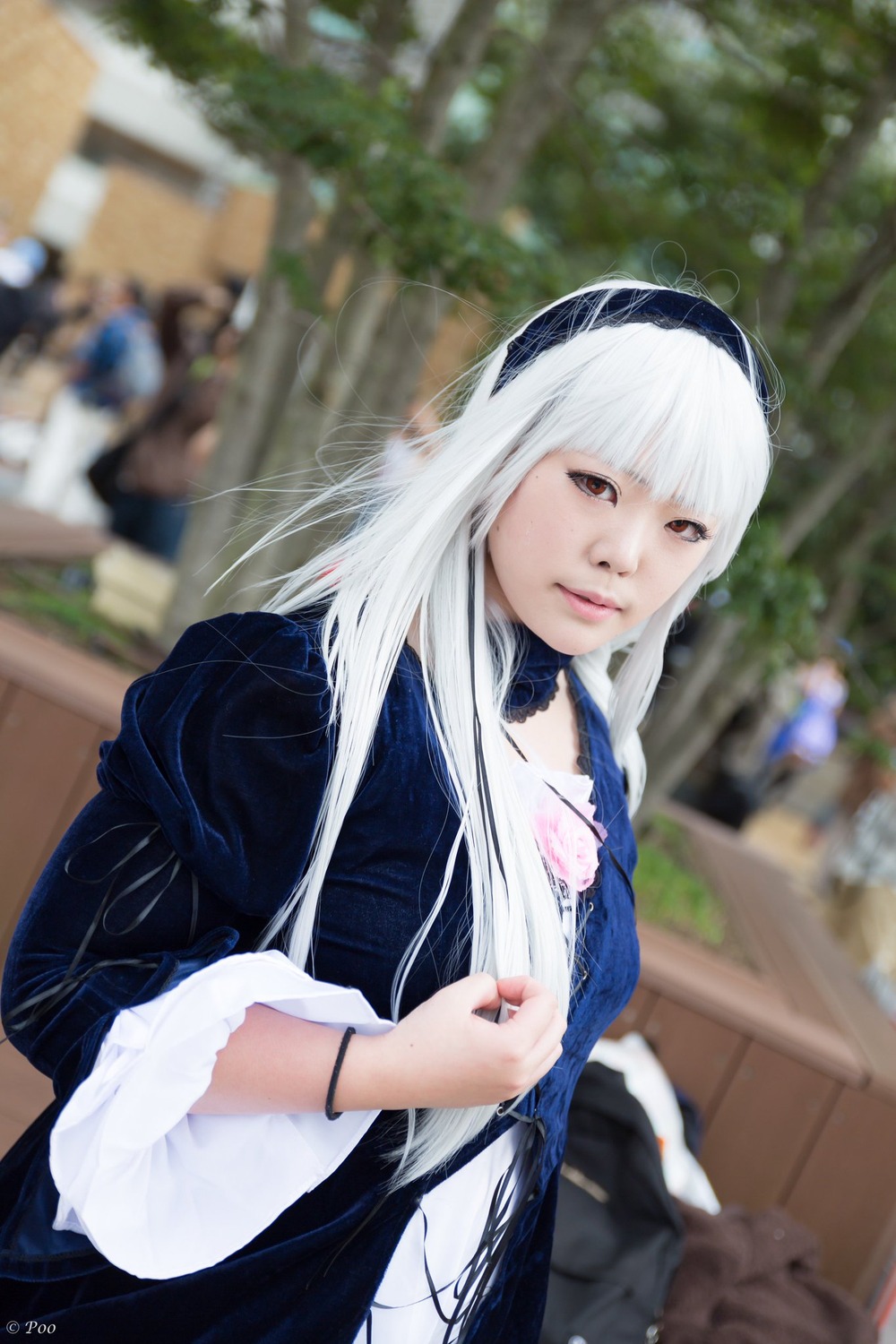 1girl 3d bangs blurry blurry_background blurry_foreground closed_mouth depth_of_field dress hairband jewelry lips long_hair long_sleeves looking_at_viewer nail_polish photo red_eyes ring solo solo_focus suigintou white_hair