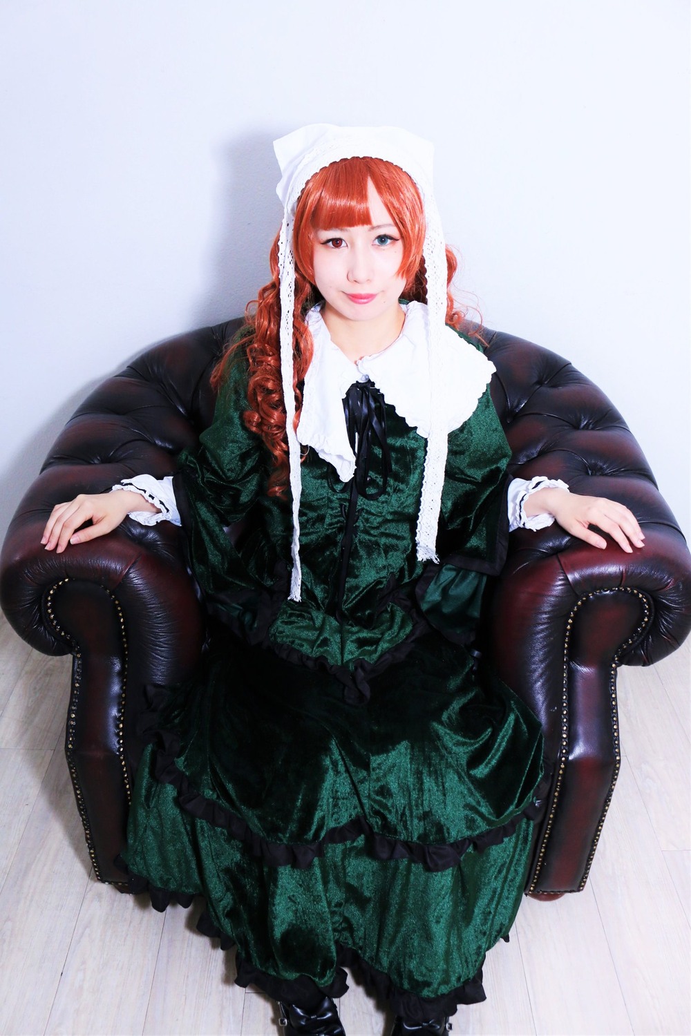 1girl bangs boots braid chair dress frills gothic_lolita green_dress lips lolita_fashion long_hair long_sleeves looking_at_viewer pantyhose red_hair sitting solo suiseiseki twin_braids