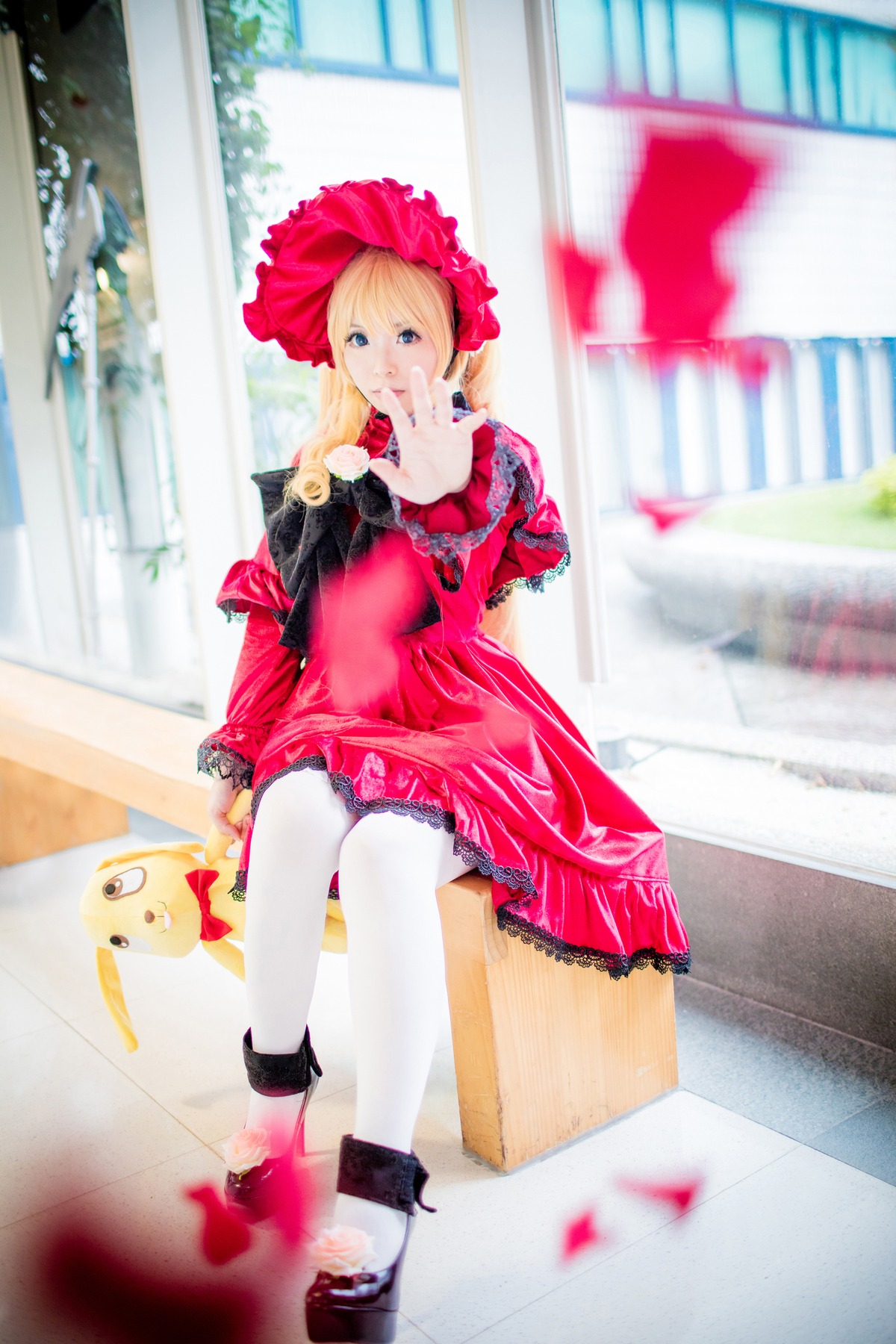 1girl blonde_hair blue_eyes blurry depth_of_field dress photo shinku sitting solo white_legwear