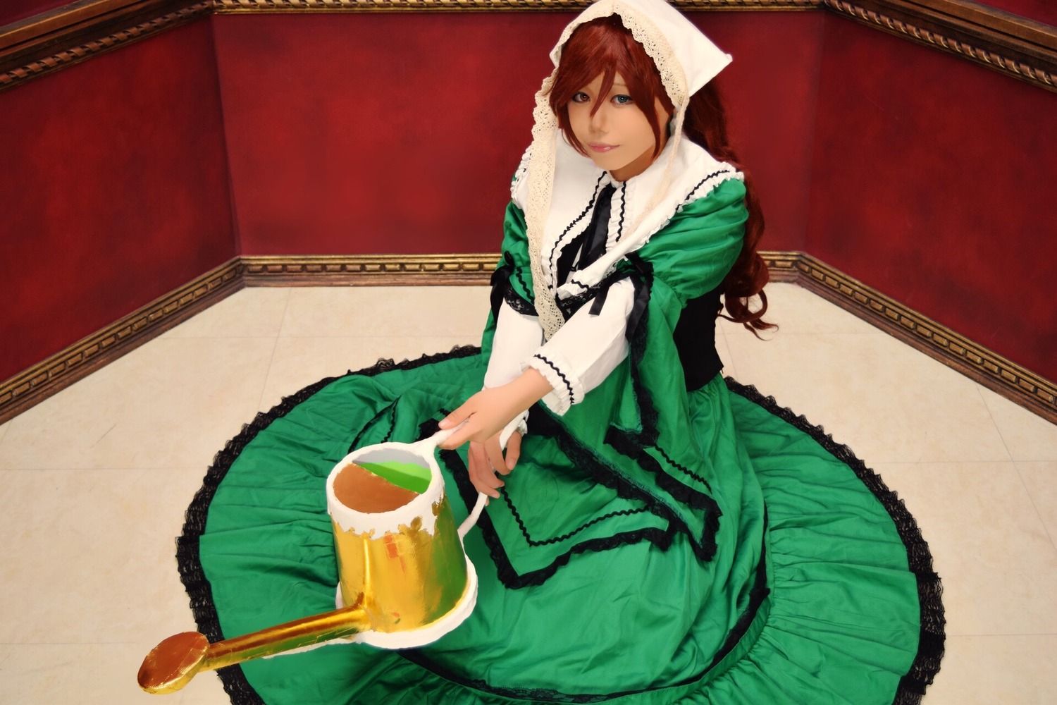 1girl alcohol brown_hair cup dress green_dress green_eyes long_hair sitting solo suiseiseki